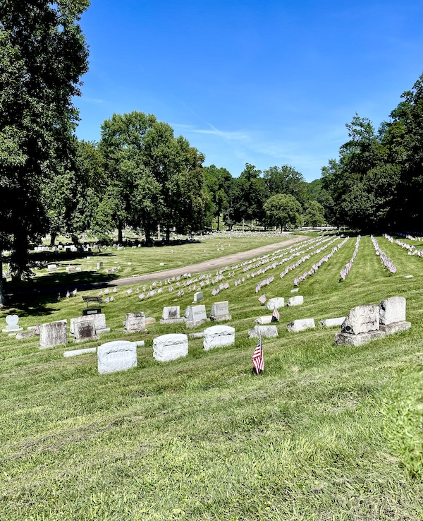 Military section of Allegheny Cemetery Pittsburgh Pennsylvania with rows of monuments and American flags