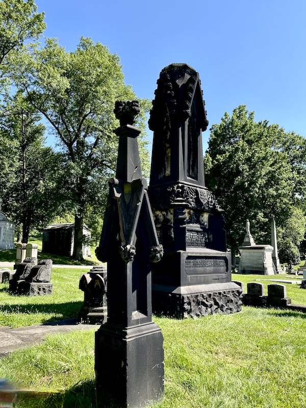 Tall black granite monuments of a section of lawn at Allegheny Cemetery Pittsburgh Pennsylvania
