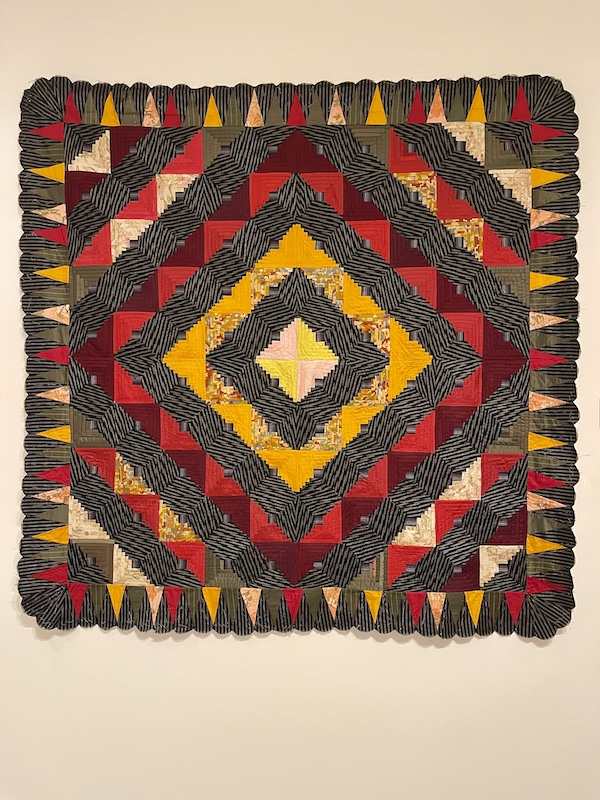 Red, gray black and gold quilt on wall of Allentown Art Museum