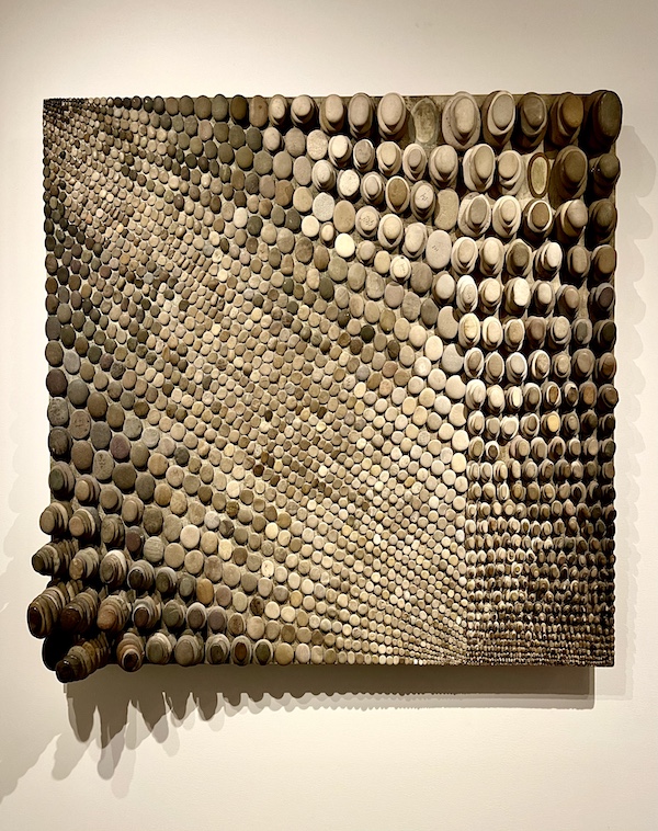 Undulating rows of smooth river stones on panel at Allentown Art Museum