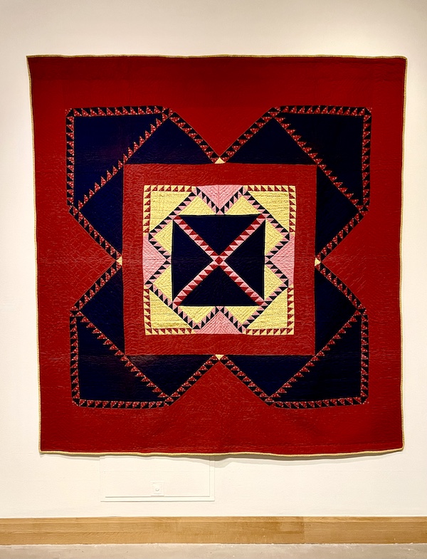 Red black and yellow quilt with square center at Allentown Art Museum Quilts