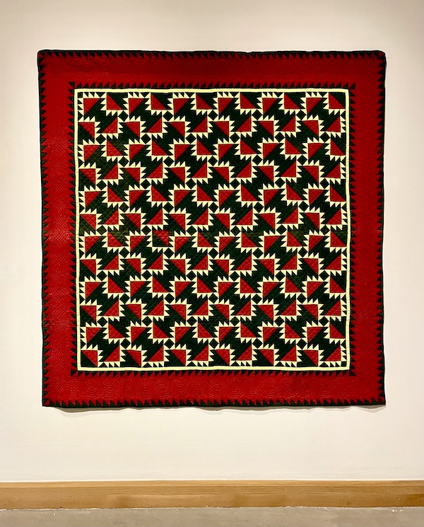 Red, black and pale yellow maize pattern with red border quilt at Allentown Art Museum Quilts