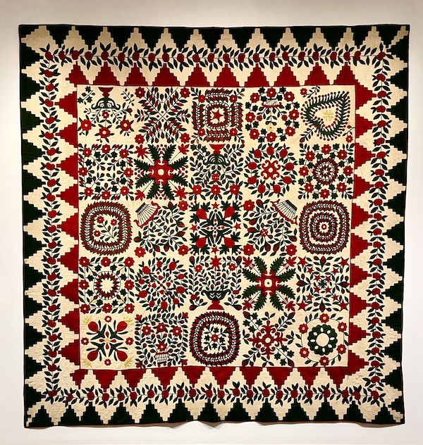 Multicolored quilt with many different floral patterns at Allentown Art Museum Quilts