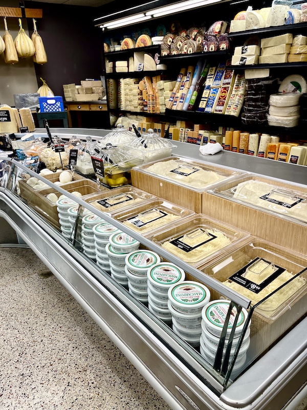 DeLallo Italian Marketplace including containers and bins of grated cheese