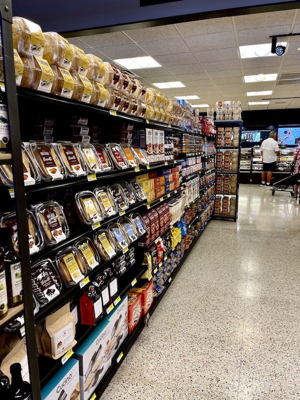 DeLallo Italian Marketplace aisle lined with shelves filled with assorted cookies