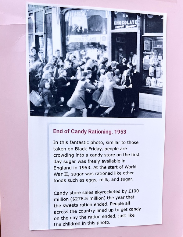 Black and white photo of people storming the entrance of Wilson Candies Jeannette PA in 1953, when candy rationing ended.