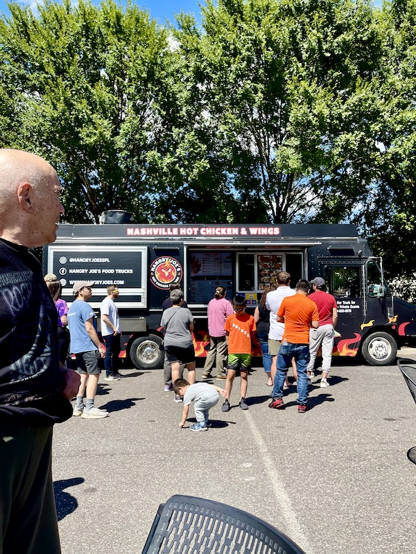Steve in foreground ready to get in the line for a food truck at the Bethlehem Steel Stacks