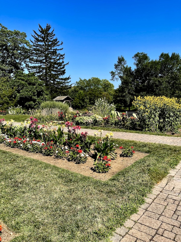 Rectangular flower beds, lawn and trees at Malcolm Gross Rose Garden