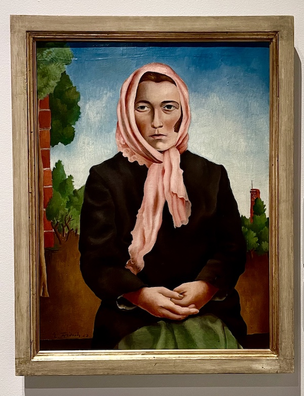 Portrait of a woman wearing a pink scarf on her head at the WW2 Museum Degenerative Art exhibit
