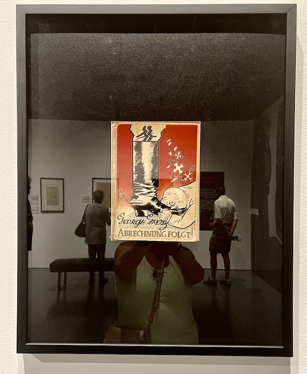 Red black and ivory caricature of a bald man kissing a boot at the WW2 Museum Degenerative Art
