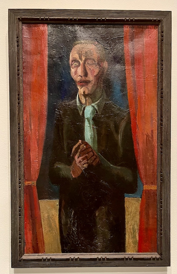 Oil painting of a lone blind man standing in between red drapery on display at the WW2 Museum Degenerative Art exhibit