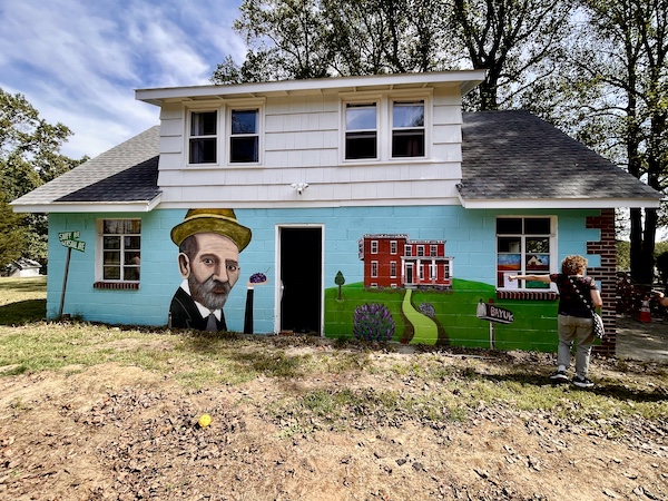 Mural on a house of a Rabbi, a bird and a donkey at the Alliance Colony Pittsgrove NJ