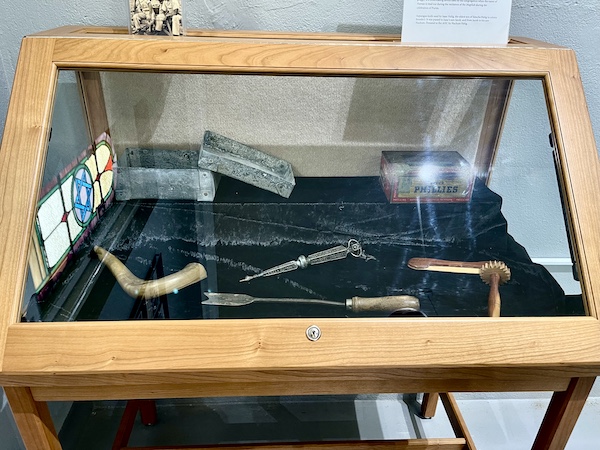 Antique items used in Jewish religious traditions in a display case at Alliance Colony Pittsgrove NJ