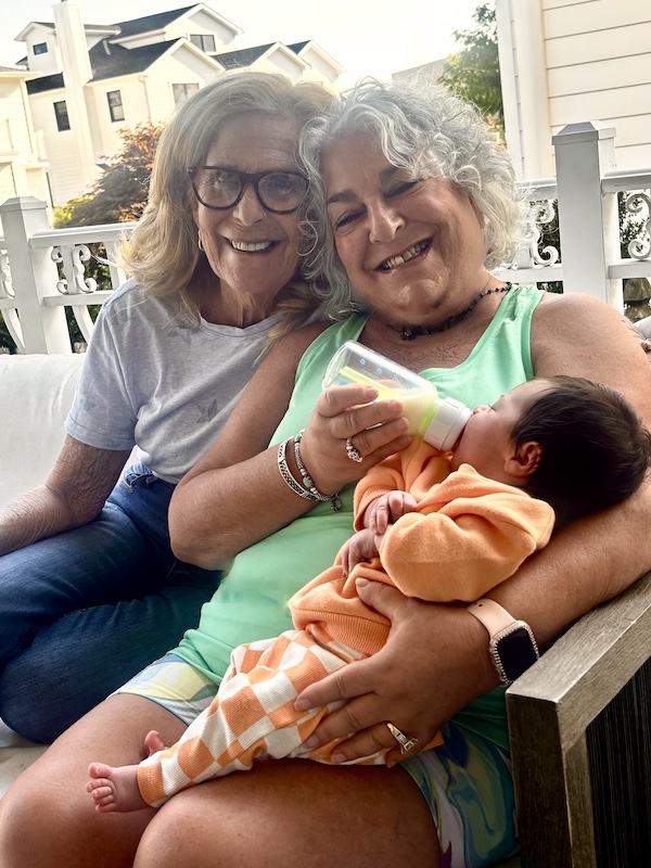Blonde woman with glassed and me holding and feeding a baby girl before our brunch at Johnny's Café Margate NJ