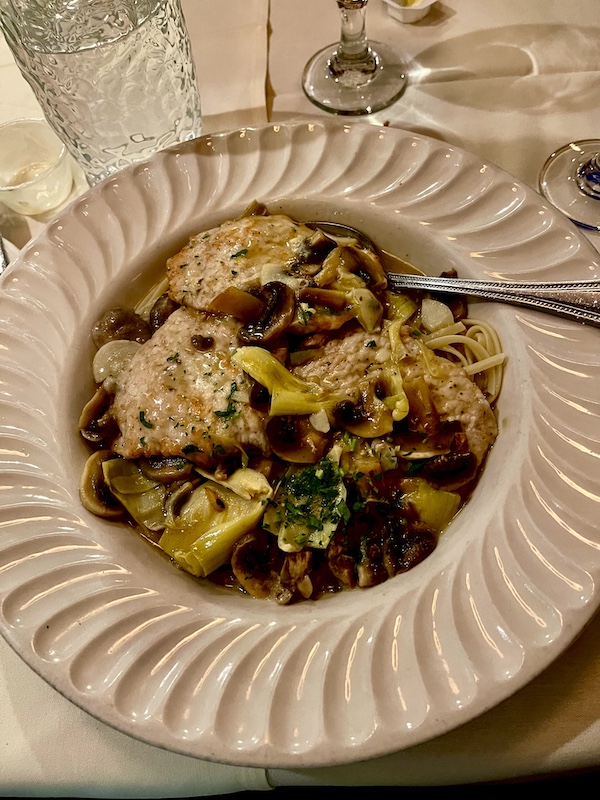 Ivory pasta bowl filled with linguine, veal scallops, artichokes, mushrooms in a lemon butter sauce at Sapore Woodfire Pizza and Restaurant