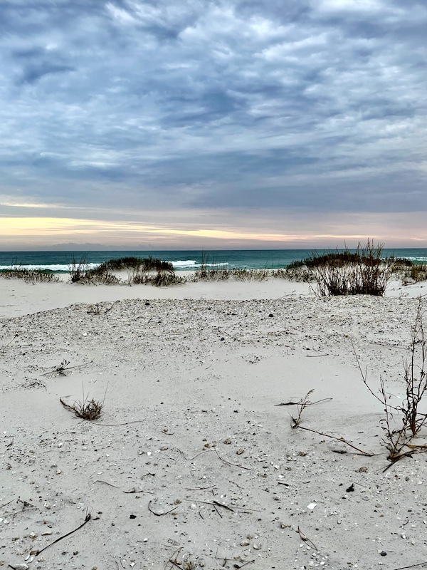 Skies darken at the beach and gulf at