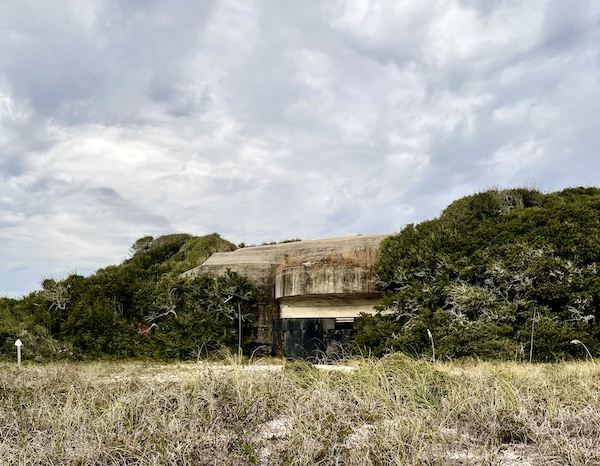 Concrete bunker hidden in the bushes at Fort Pickens Pensacola Florida
