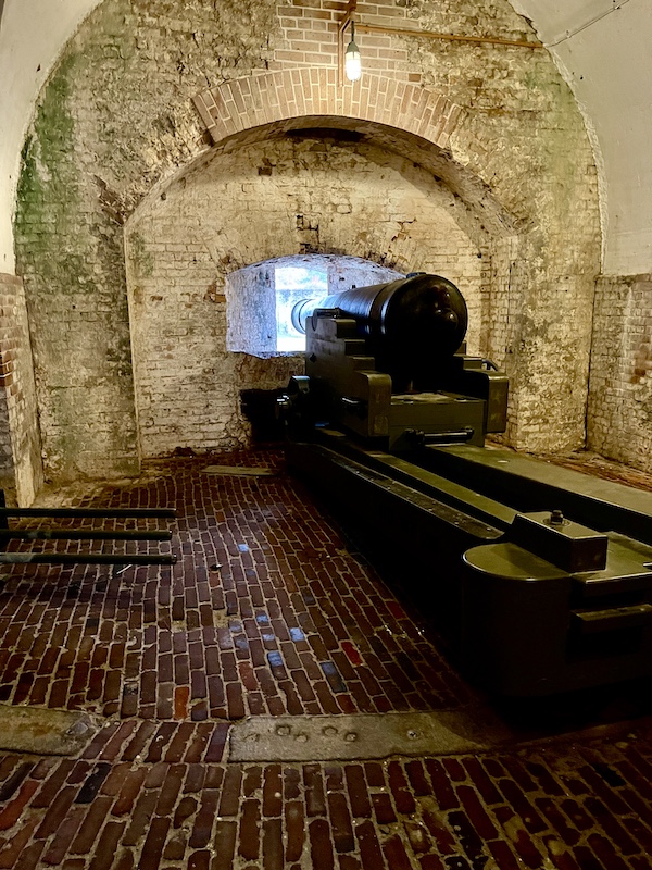 Civil War cannon on a slide rail inside a tunnel at Fort Pickens Pensacola Florida