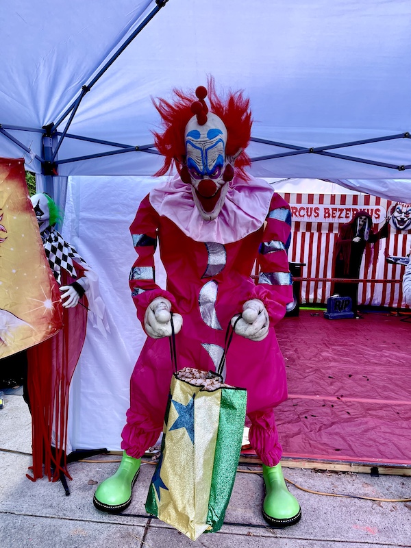 A clown with red hair and costume in a tent was more of our October Fun at Jersey Shore