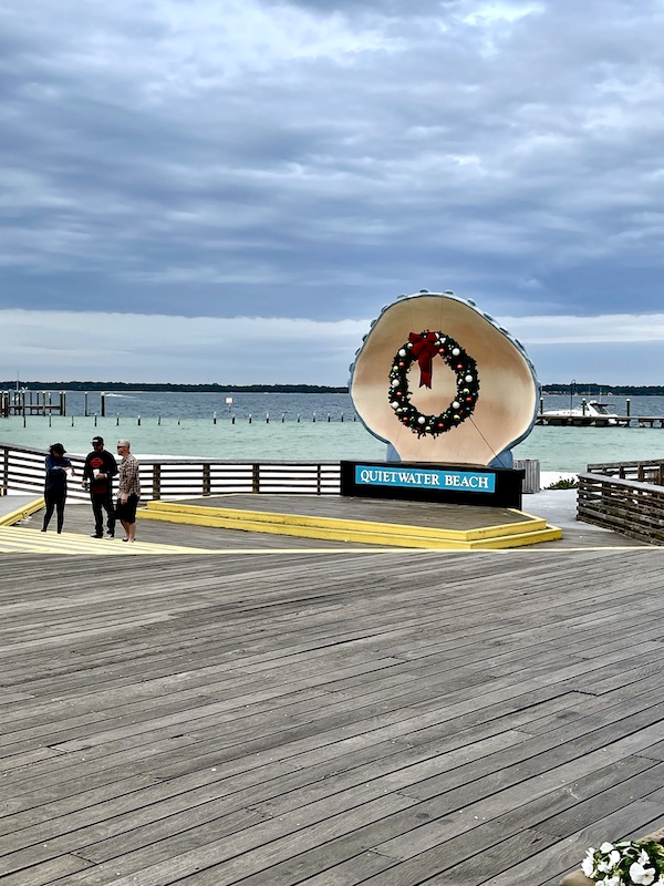 Boardwalk, beach, Gulf water and giant seashell at Pensacola Beach and Boardwalk
