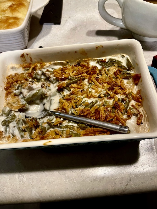 Rectangular baking dish filled with traditional Thanksgiving green bean casserole.