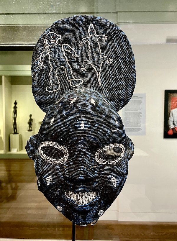 Blue black and white beaded mask on display at New Orleans Museum of Art