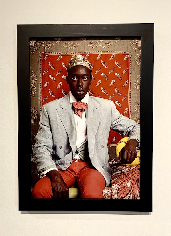 Portrait of a black man with gray jacket and red pants at the New Orleans Museum of Art