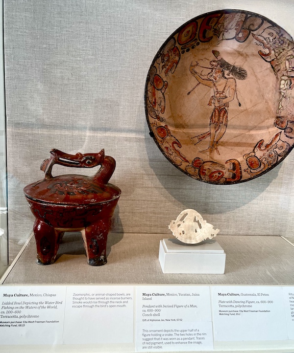 Assorted Mayan artifacts in a display case at the New Orleans Museum of Art