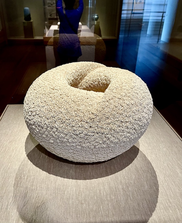 White textural cocoon like shaped object on display at the New Orleans Museum of Art