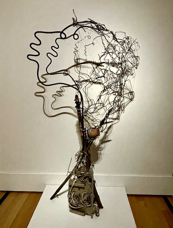 Mixed media art that resembles a tree with faces of branches on a white wall at New Orleans Museum of Art Part 2