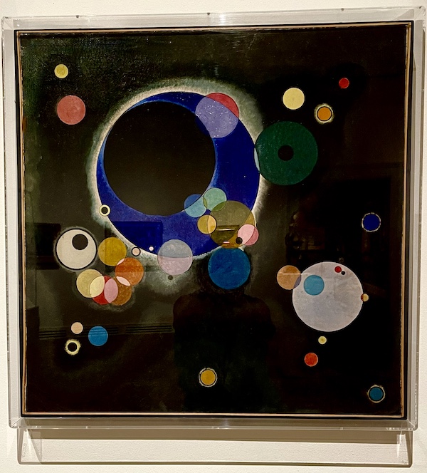 Colorful painting on black background of many circles hanging at New Orleans Museum of Art Part 2