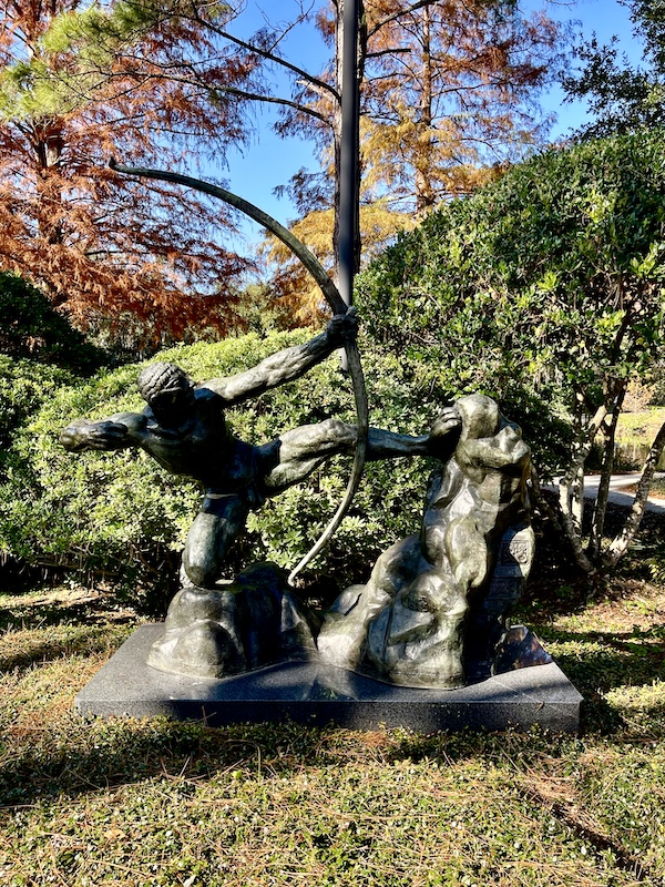 Bronze statue of Hercules with bow and arrow seen while Sharing Sculpture Garden with Friends