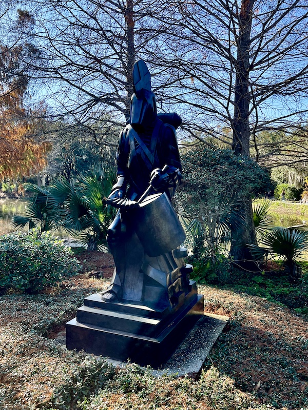 Bronze statue of a drummer with helmet on seen while Sharing Sculpture Garden with Friends