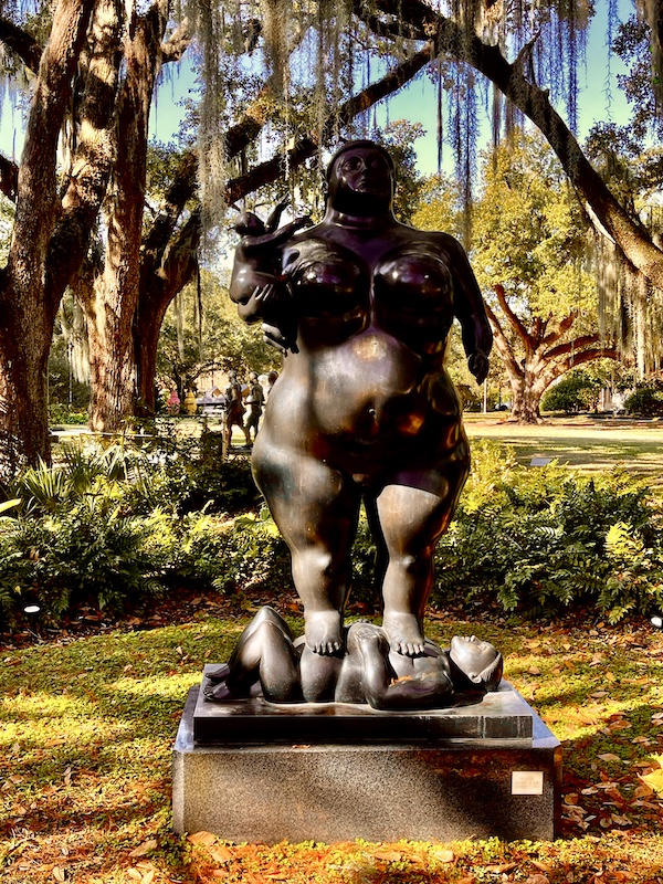 Nude of a woman and baby standing among the trees seen while Sharing Sculpture Garden with Friends