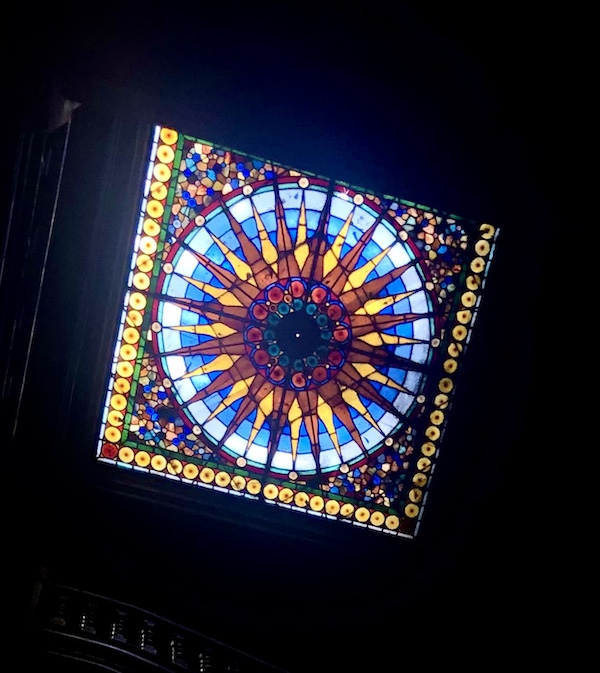 Stained glass window in the ceiling of the stairwell at The Columns New Orleans