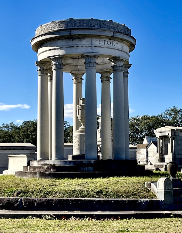 Round memorial with statue in middle at Historic Metairie Cemetery Louisiana