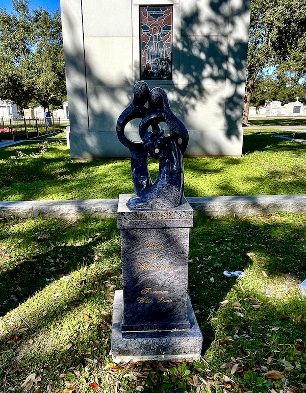 Tombstone of a loving couple in black granite at Historic Metairie Cemetery Louisiana