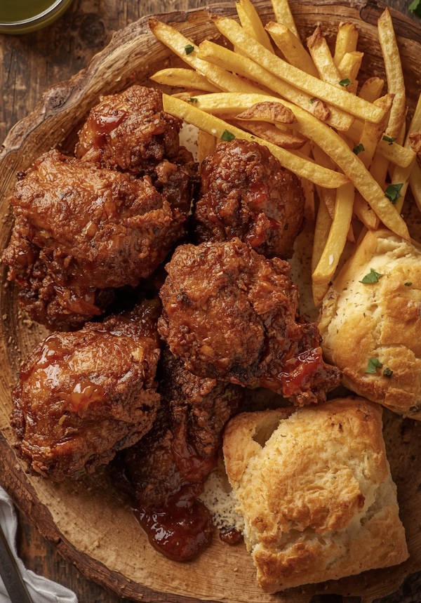 Golden brown fried chicken livers, fries and square biscuits at Mama's Fried Chicken Opelousas LA