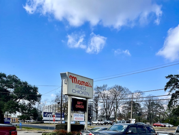 Large lit sign let's you know you have arrived at the parking lot for Mama's Fried Chicken Opelousas LA