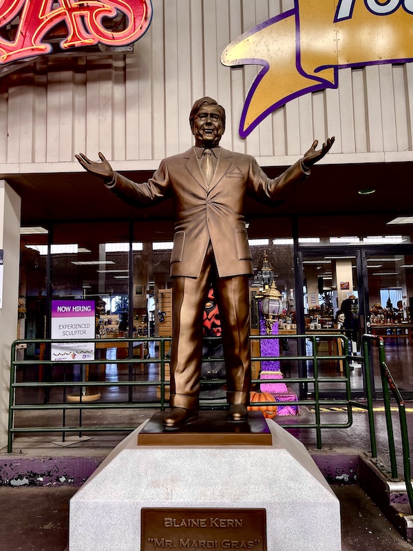 Gold life sized statue of the man who founded Mardi Gras World NOLA