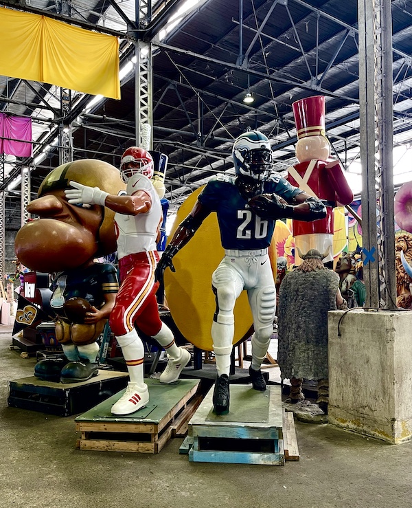 Eagles and Chiefs quarterbacks sculptures at Mardi Gras World NOLA