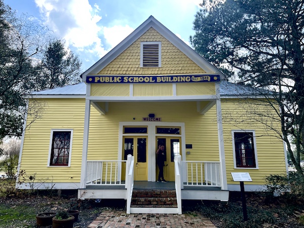 Yellow clapboard building that was the old schoolhouse in Le Vieux Village Opelousas LA