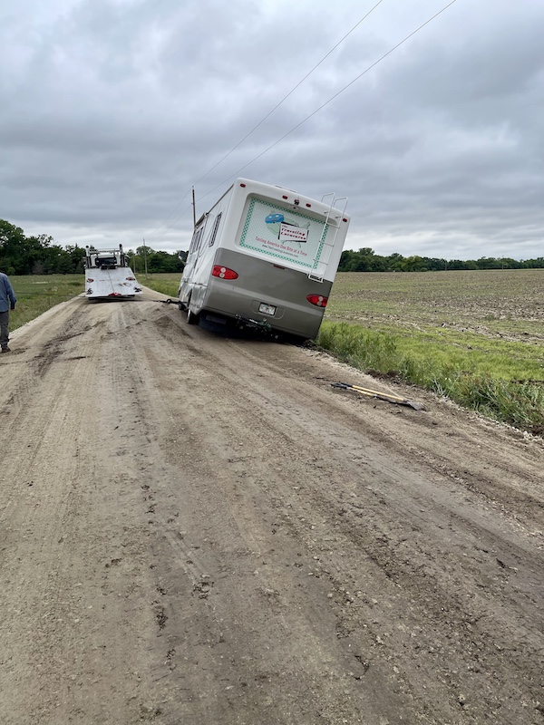 Using chains the tow truck company inched us onto the road so we could be Finally Back on the Road!!!