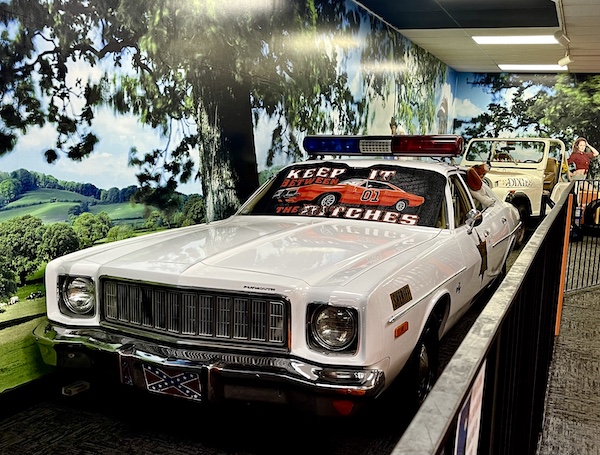 The white sheriff's car from Dukes of Hazard with sign on the windshield that says Keep it between the ditches.