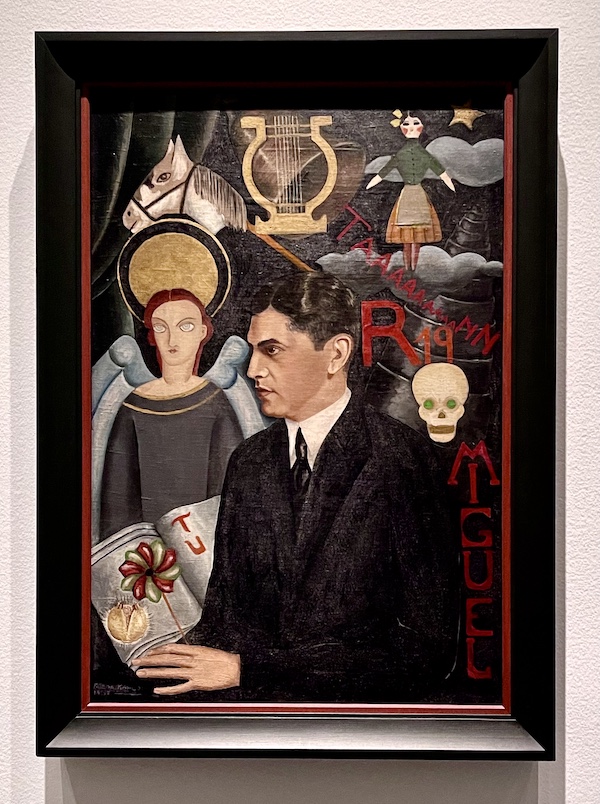 Portrait of a man with woman, doll, lyre, horse and skull at the Frida Kahlo Exhibit Houston