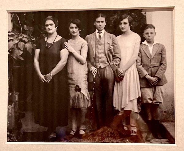 Sepia toned photo of 4 women and a boy. the woman in center is dressed as a man. At the Frida Kahlo Exhibit Houston