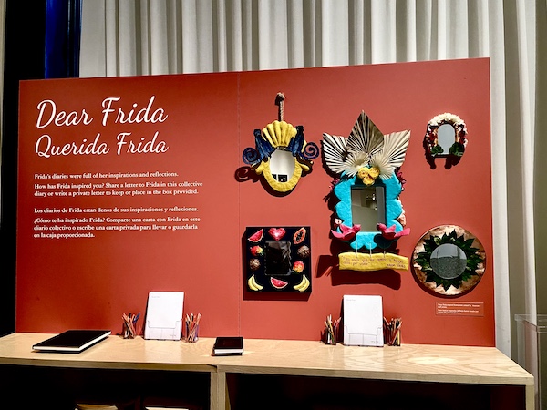 Colorful mural introducing you to the Frida Kahlo Exhibit Houston