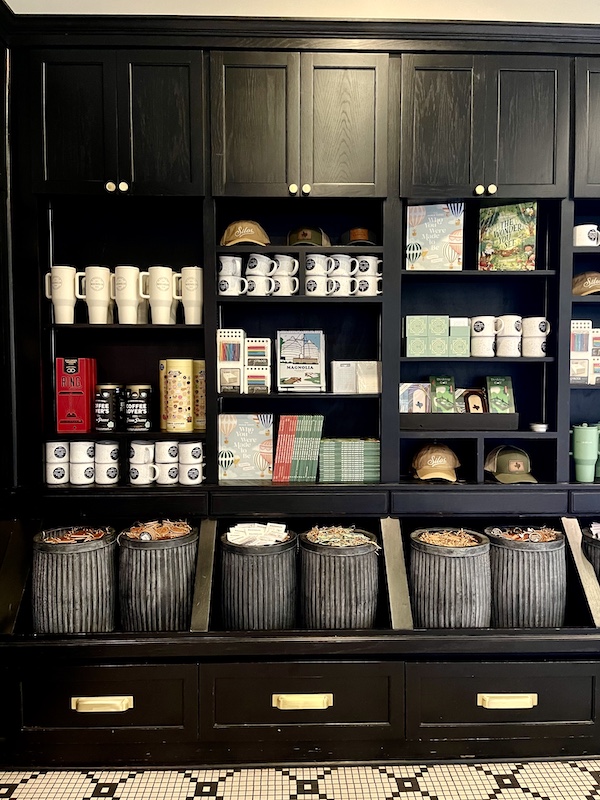 Display of coffee mugs, barrels of tea bags and cup at Magnolia Table Waco Texas