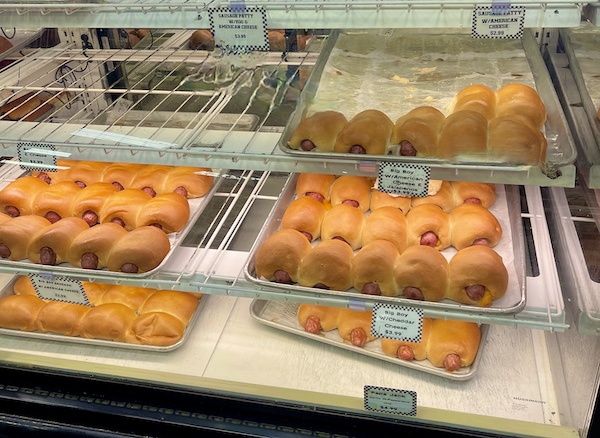 Display case of assorted sausage stuffed bread at Slovacek's in West Texas