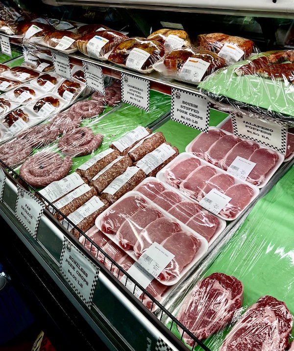 Meat case filled with pork chops and other meats at Slovacek's in West Texas